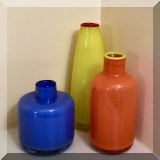 G01. Three colorful glass bottles. 